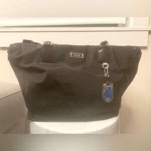 Tumi nylon bag.